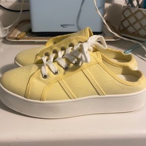 New yellow slip on sneakers